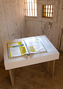 Photo of the open offence book in a holding cell