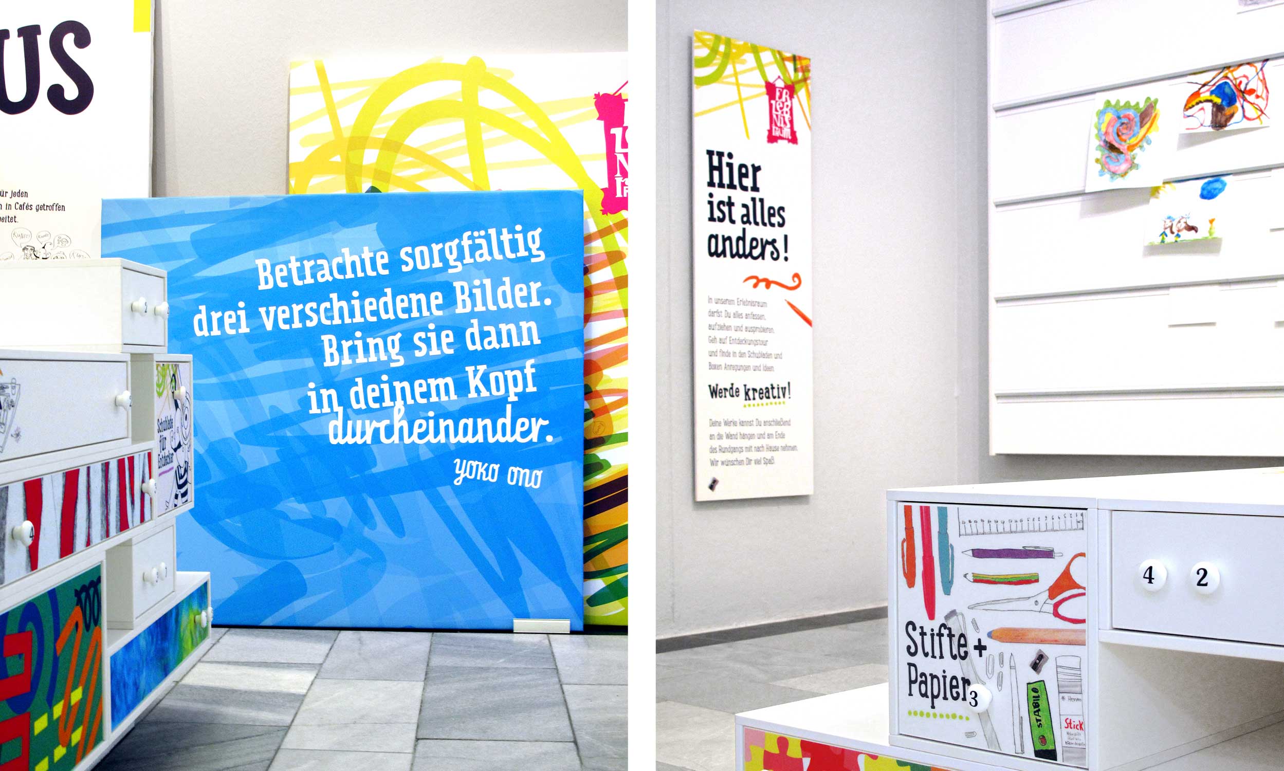 Two detail shots of the experience space. In the first image, a blue, square canvas is in focus, presenting a quote by the artist Yoko Ono in a white, diagonally arranged, cheerful typeface. Behind the blue canvas, a slightly higher canvas can be seen. It is printed with colourful scribbles. On the left in the foreground, a corner of the chest of drawers with many colourful drawers can be seen. The second picture shows another section of the room. An oblong board in portrait format with text information in a cheerful font, decorated with colourful graphic elements, is mounted on the wall on the left. On the right side of the wall is a white pin board, decorated with some children's drawings. In the foreground, a drawer is in focus, decorated with illustrations of pens, scissors, glue sticks and other office supplies. Inside, the children find all kinds of pens and paper tools.