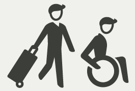 Piktogramme eines Menschen im Rollstuhl und einer Person mit Rollkoffer, zur Kennzeichnung der barrierefreien Zugänge
