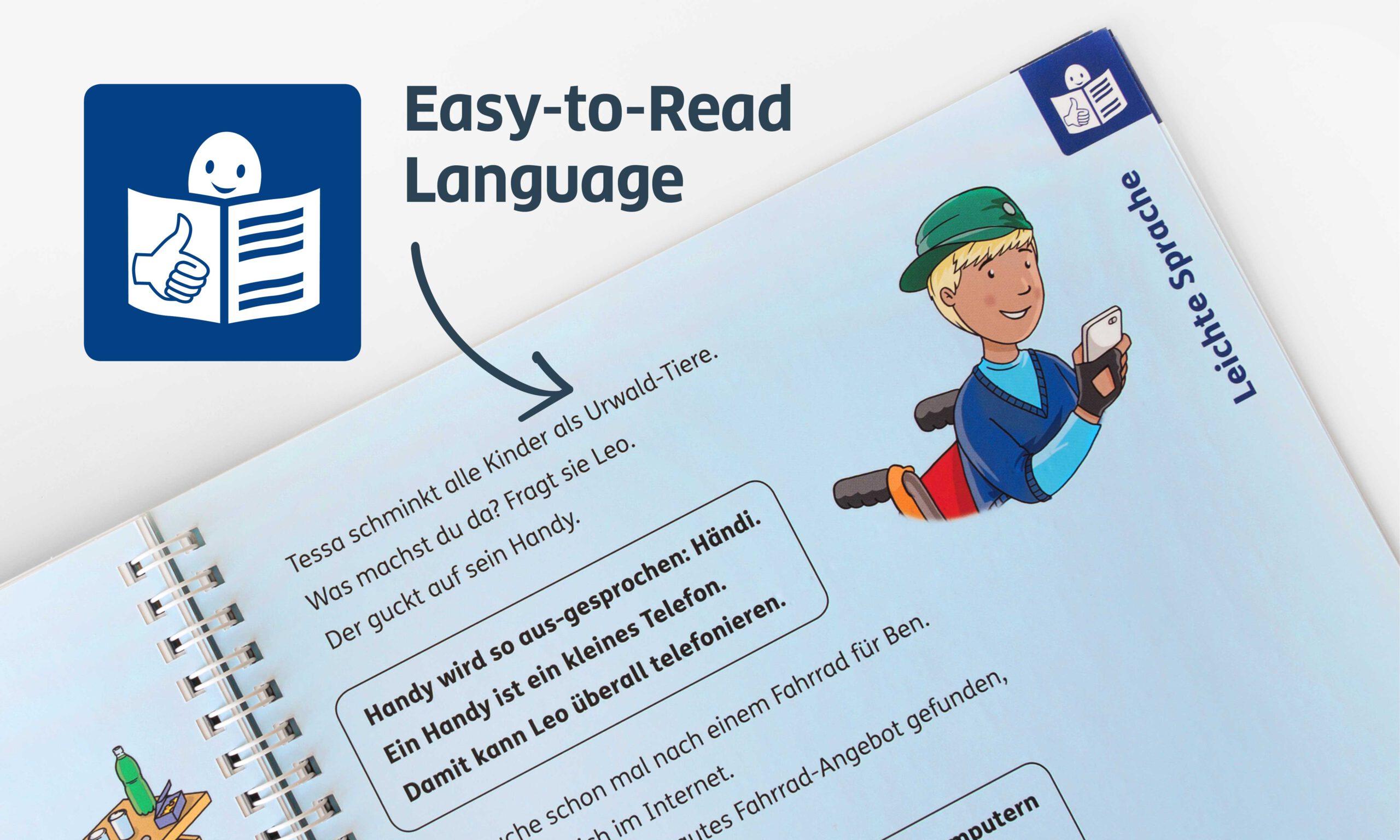 Close-up of a blue easy language page, which always follows a double page with everyday language and Braille. In the upper left corner of the picture is a pictogram for easy language. An arrow points to the book page.