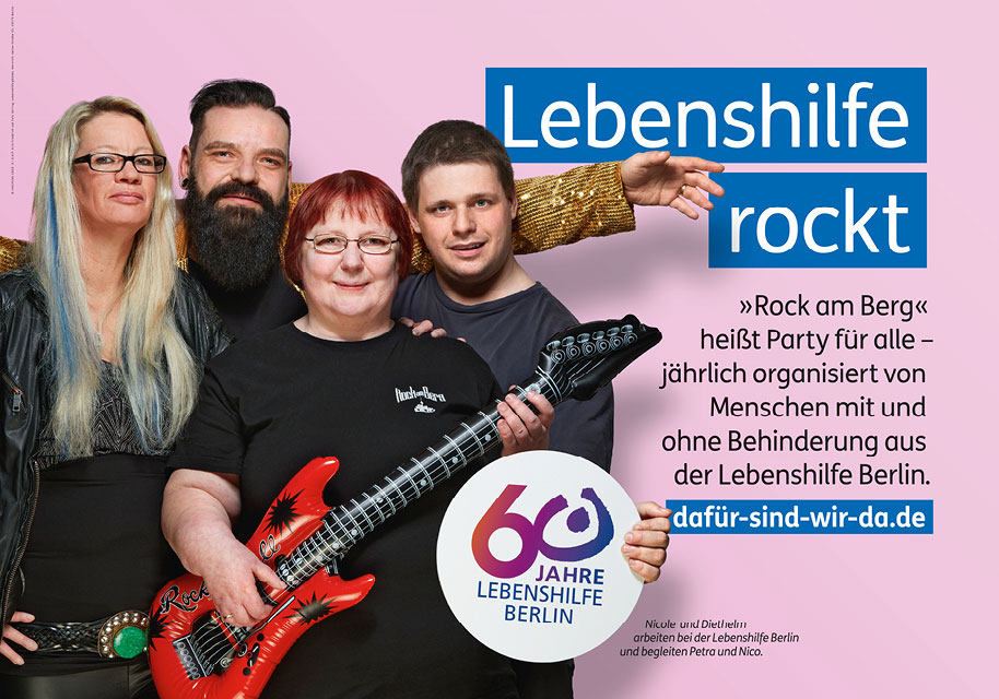 Large poster of the motif "Lebenshilfe rocks" with four people who organize a party for people with and without disabilities every year.