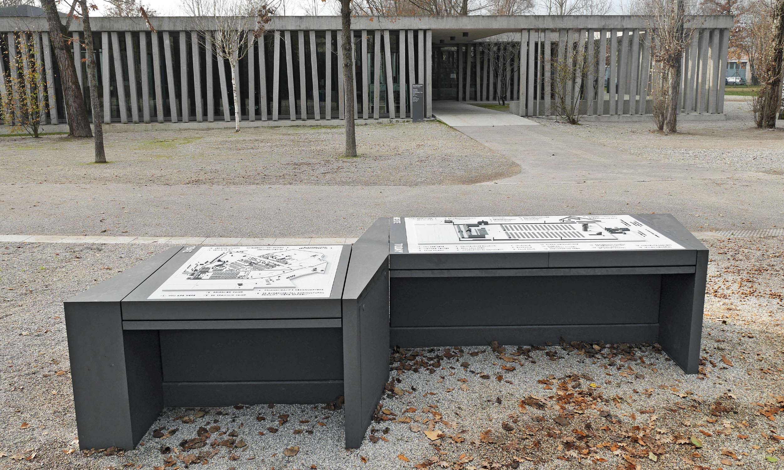 Photo of the two installed tactile models in front of the entrance to the Dachau Concentration Camp Memorial Site.