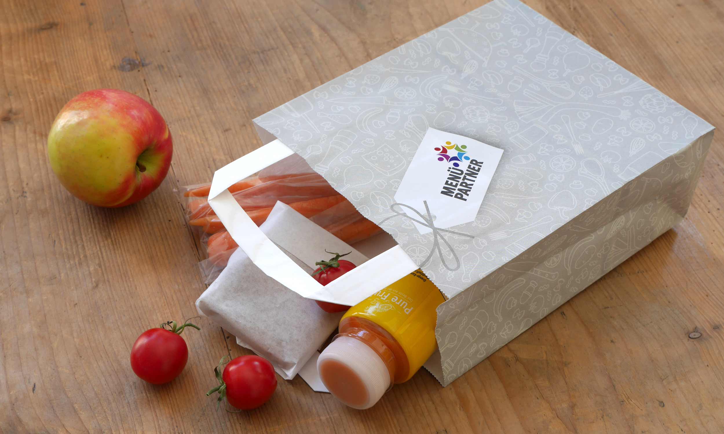 Photo of a paper food bag with healthy contents for field trips by day-care and school children