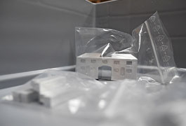 A detailed view of an untreated house model still packaged in transparent foil