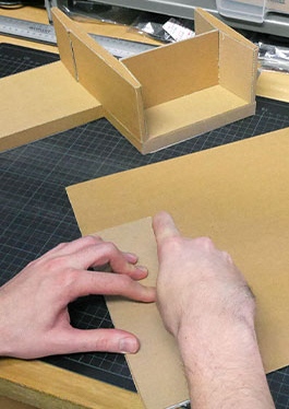 Photo of the assembly of a cardboard model as a functional model for model construction