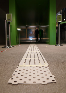 A close-up view of the stencils glued to the floor for the floor indicators in the entrance area of the Neanderthal Museum.