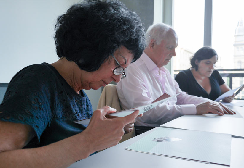 Photo of several participants at one of the focus group meetings. The tactile elements of the tactile book were tested with the help of swell paper