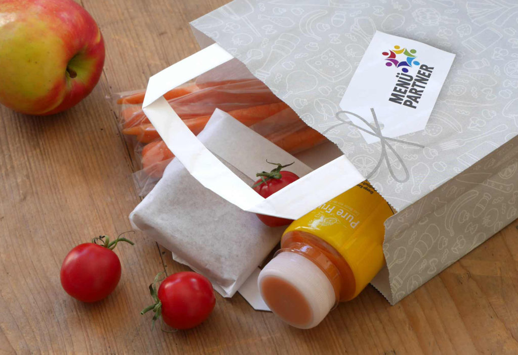 The project picture shows a paper lunch bag with healthy contents for field trips by daycare and school children.